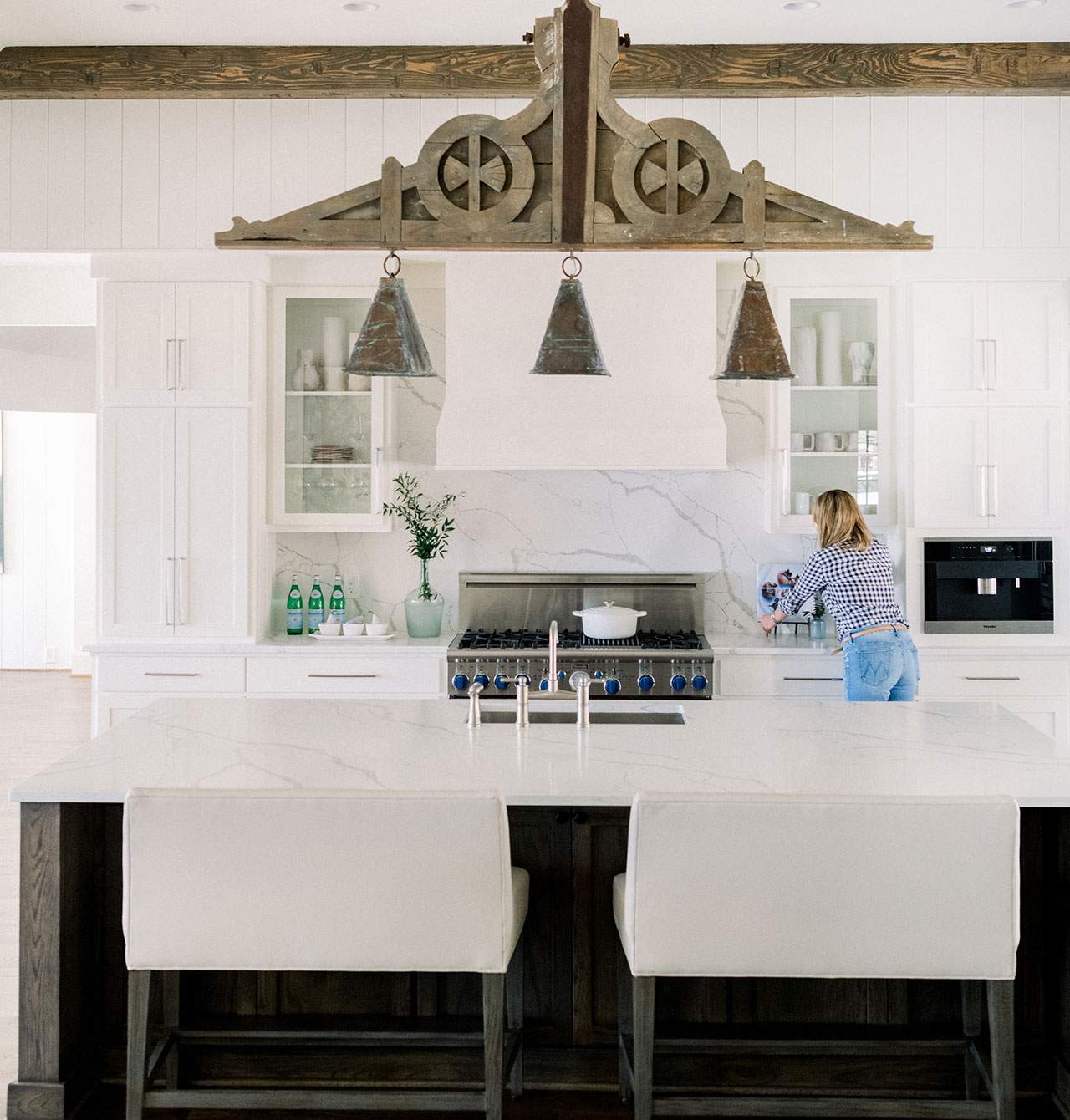 renovated kitchen with white cabinets and countertops