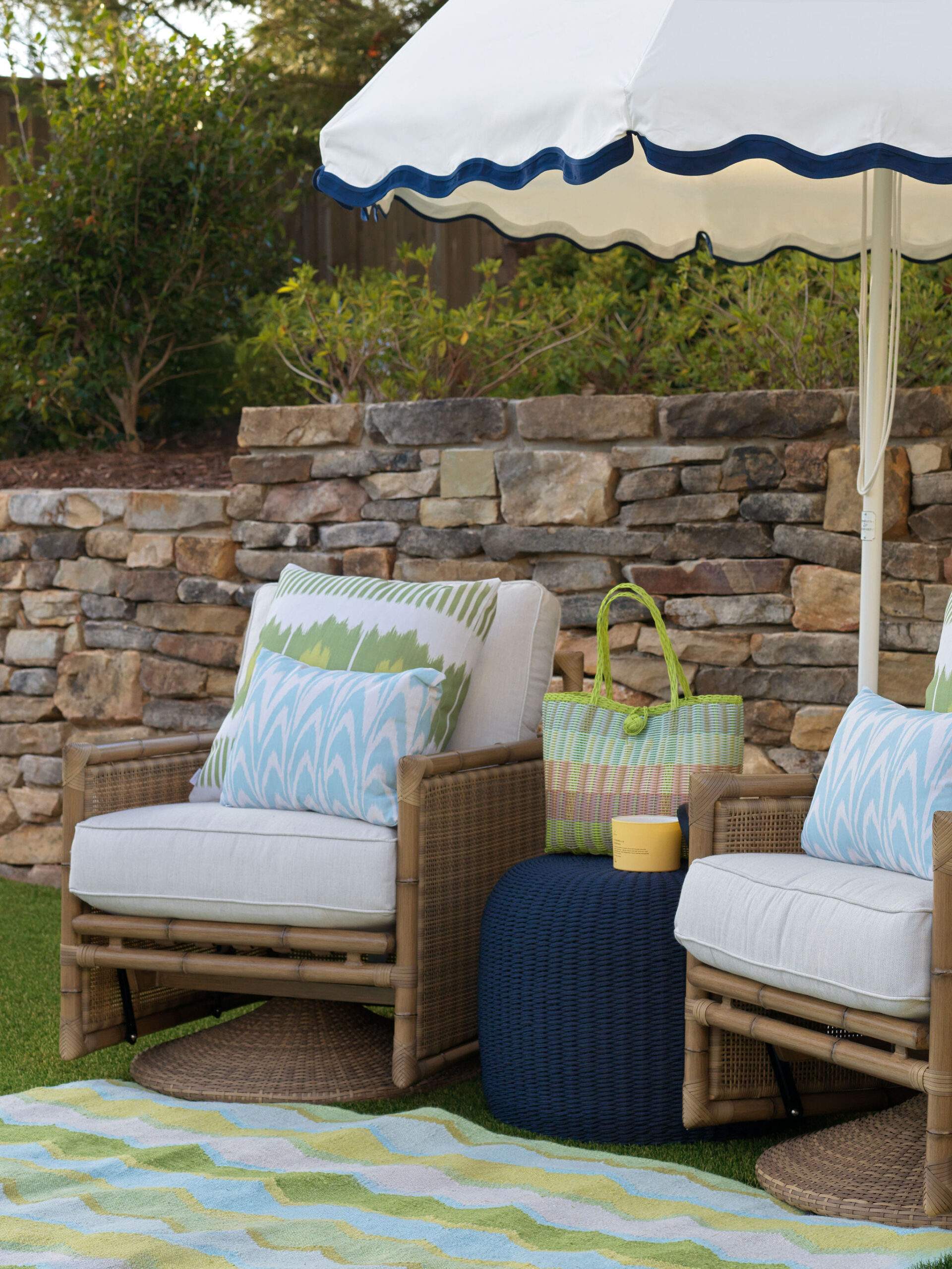 chairs under umbrella at pool